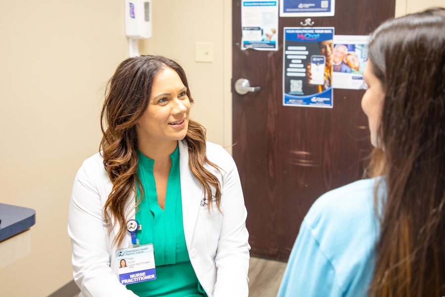 a doctor speaks with a patient