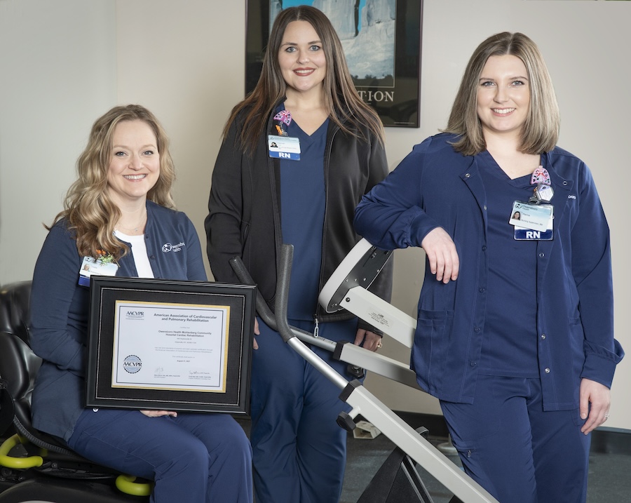 three nurses in blue scrubs