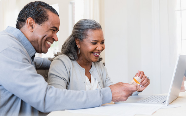 couple researching a pharmacy options online