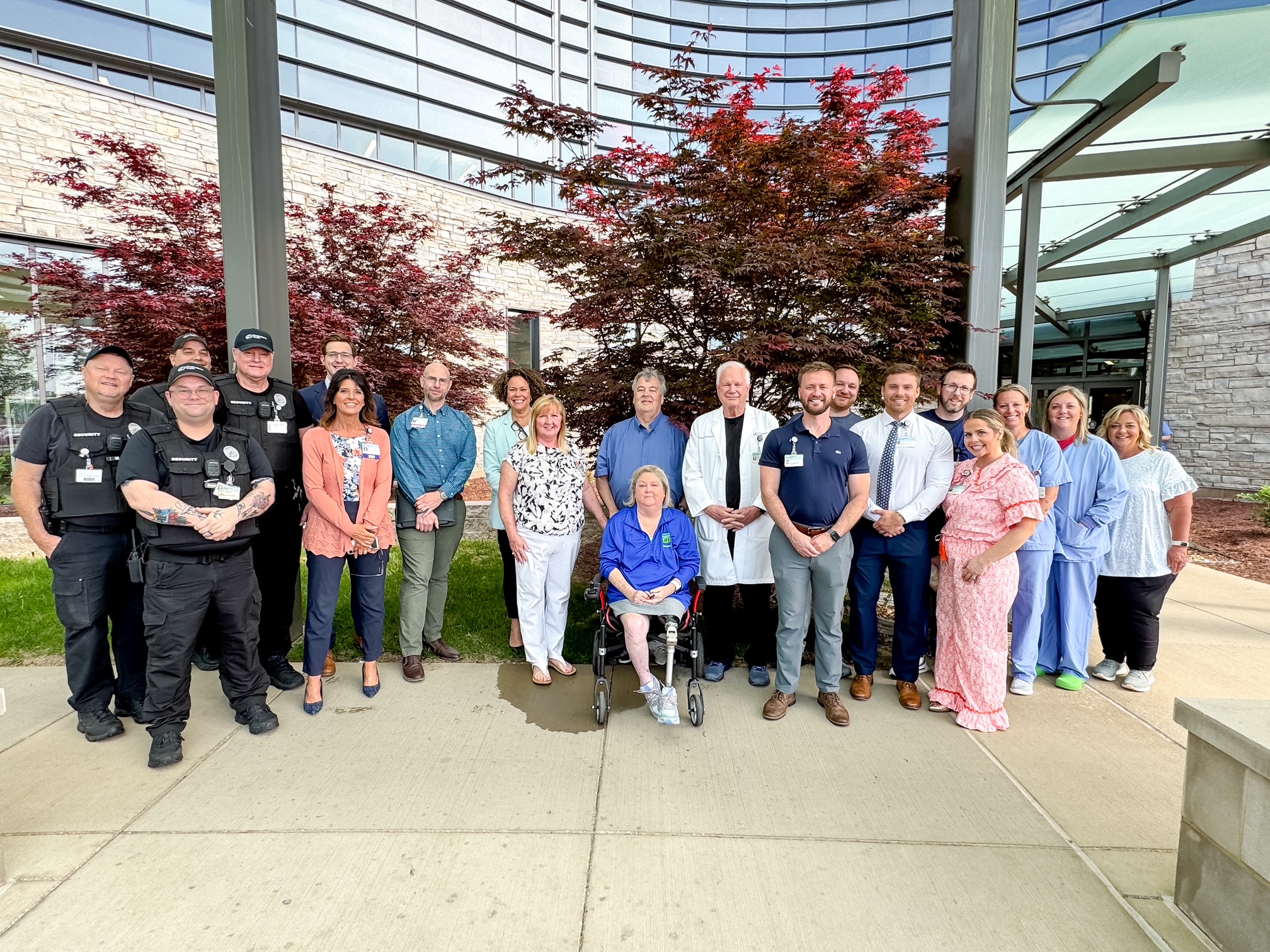 group of people in front of a hospital