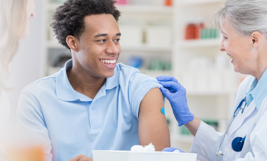 team member receiving a flu shot