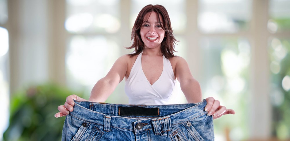 Excited Slim African Woman Wearing Oversized Pants After Weight-Loss Indoor  Stock Photo by Prostock-studio