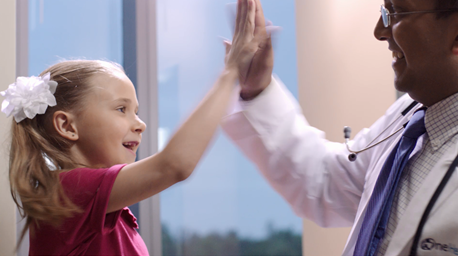 patient high-fiving doctor