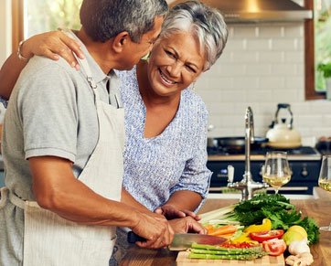 Two people chopping vegetables