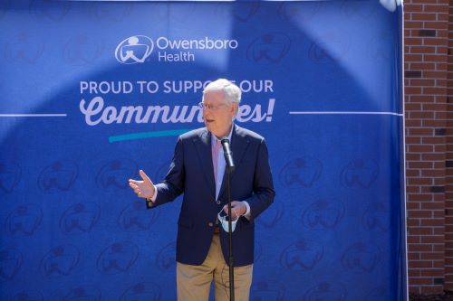 Mitch McConnell in front of microphone