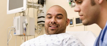 man in hospital bed