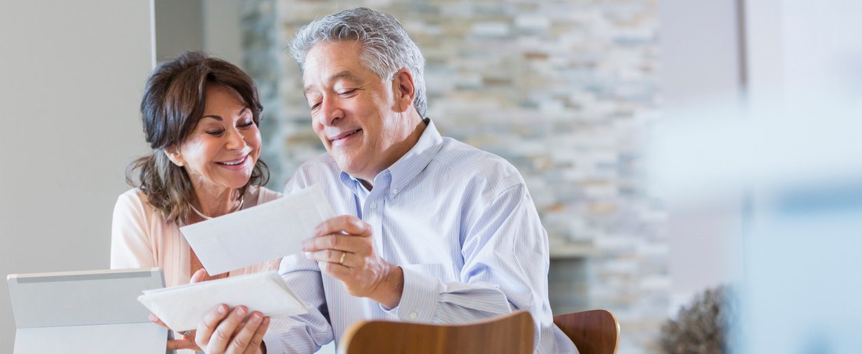 Couple looking at paid hospital bills