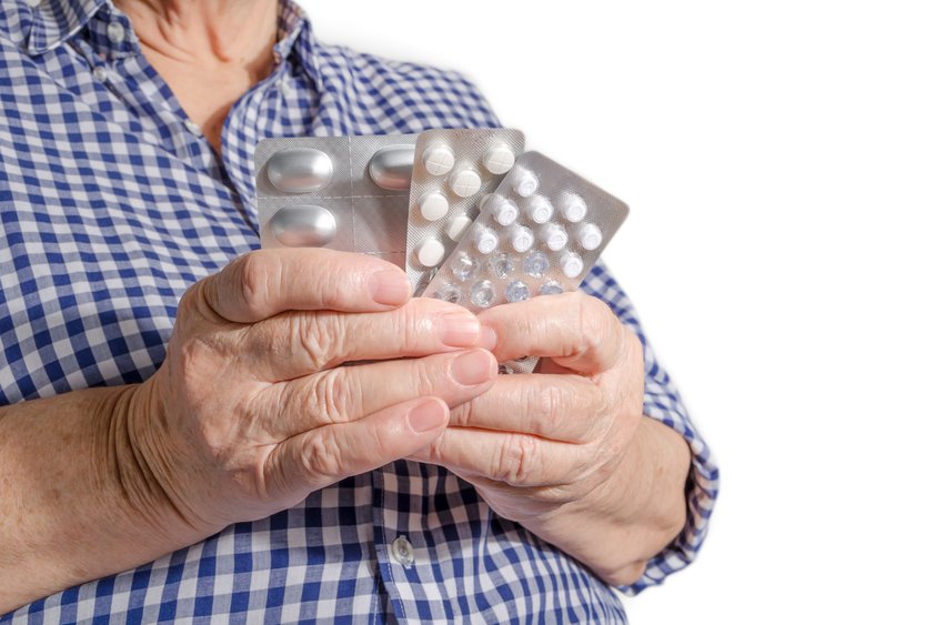 person holding pill packs