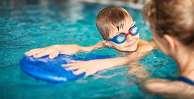 Child taking swim lessons