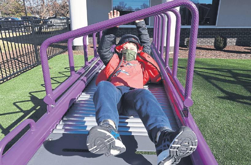 kid playing on playground