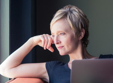 Woman looking out a window