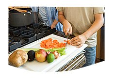 man chopping vegetables