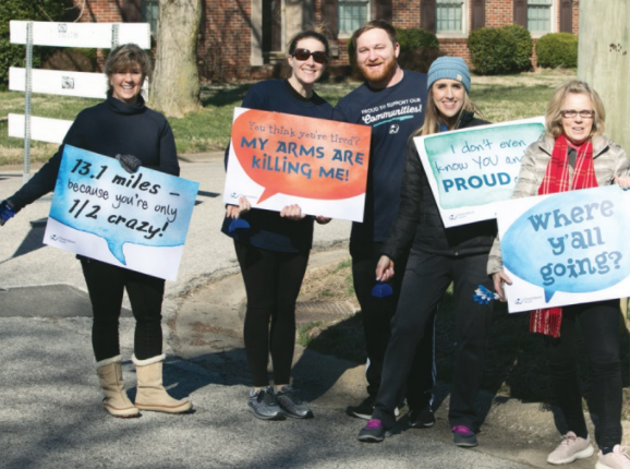 Holding up encouraging signs