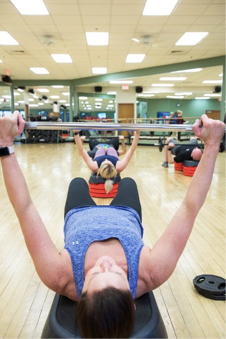 group exercise class lifting weights