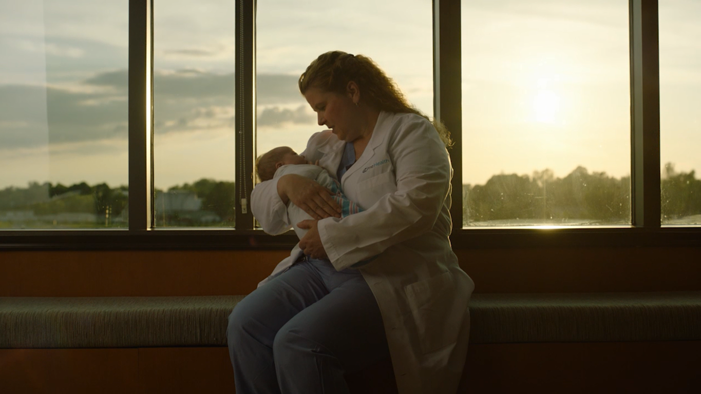 woman holding baby