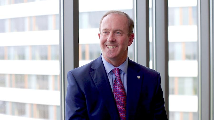 man in suit by window