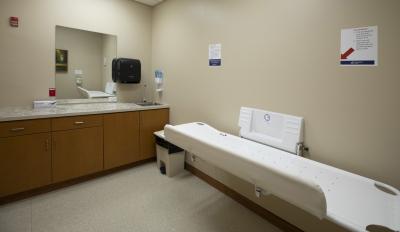 tan room with a large changing table