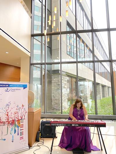 Diane Earle plays the keyboard in the OHRH lobby