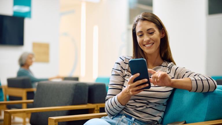 woman using her smart phone