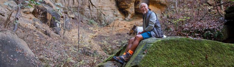 a person hiking with their dog