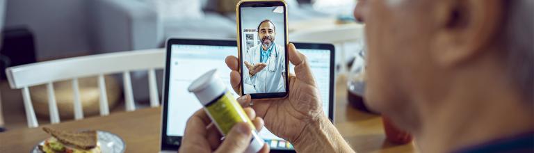 man video chatting with doctor