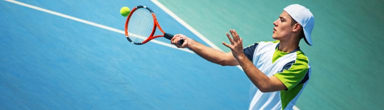 young man playing tennis