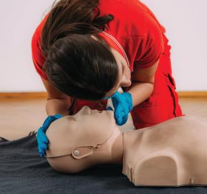CPR class participant and dummy