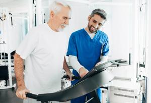 senior patient having physical therapy with his therapist